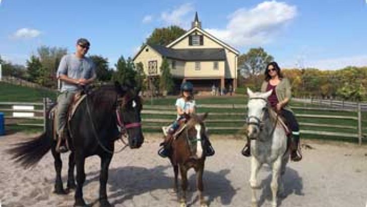 family on horses